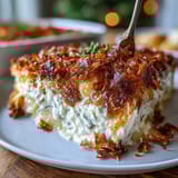 Cheesy shredded potato casserole lightened with Greek yogurt, baked until bubbly and served hot from the oven.  
