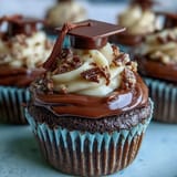 Simple graduation cupcakes with cap toppers feature vanilla cupcakes topped with buttercream frosting and edible graduation caps made from chocolate and candy.