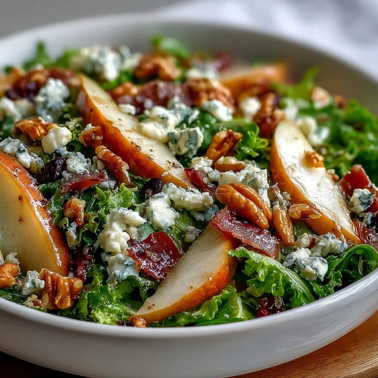 Close-up of Frisée Pear Blue Cheese Bowl, highlighting crunchy walnuts, tender pears, and rich blue cheese crumbles.