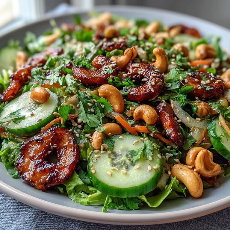 Vibrant celery peanut salad tossed with red bell pepper, scallions, and zesty soy ginger dressing, topped with chopped peanuts and sesame seeds.